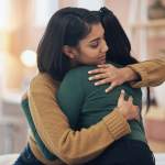 Two women hugging