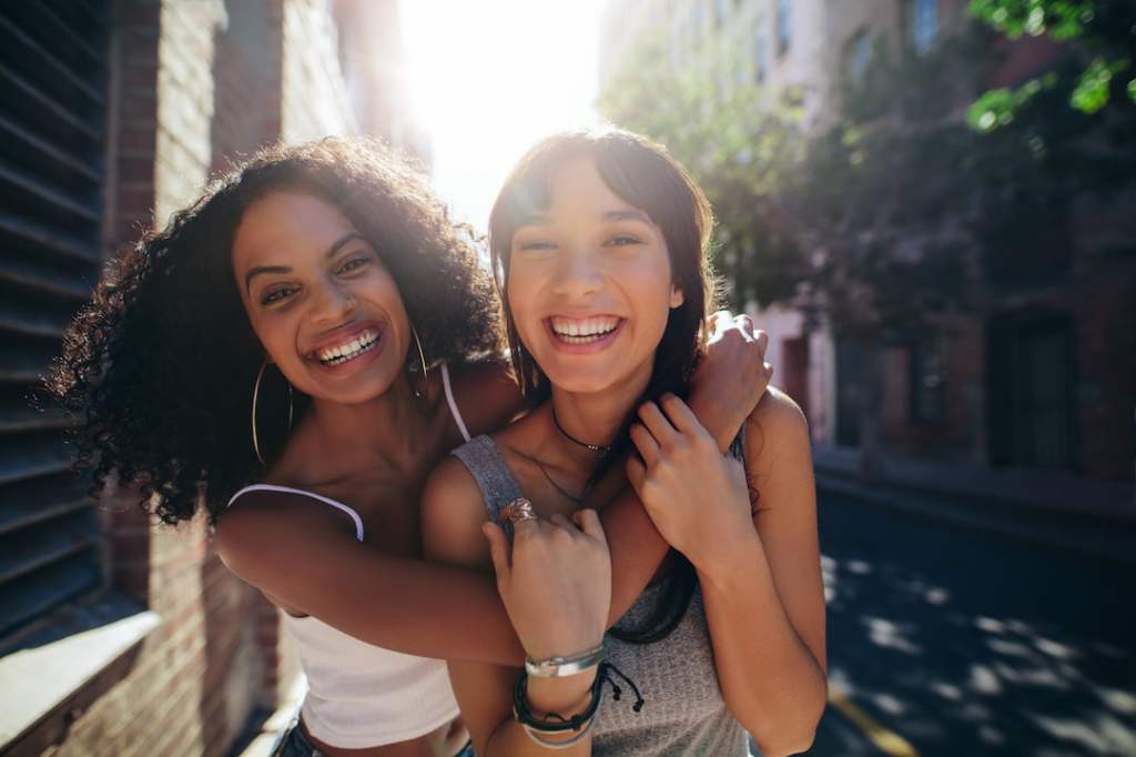 Two women hugging in the street