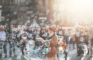 woman outside with bubbles