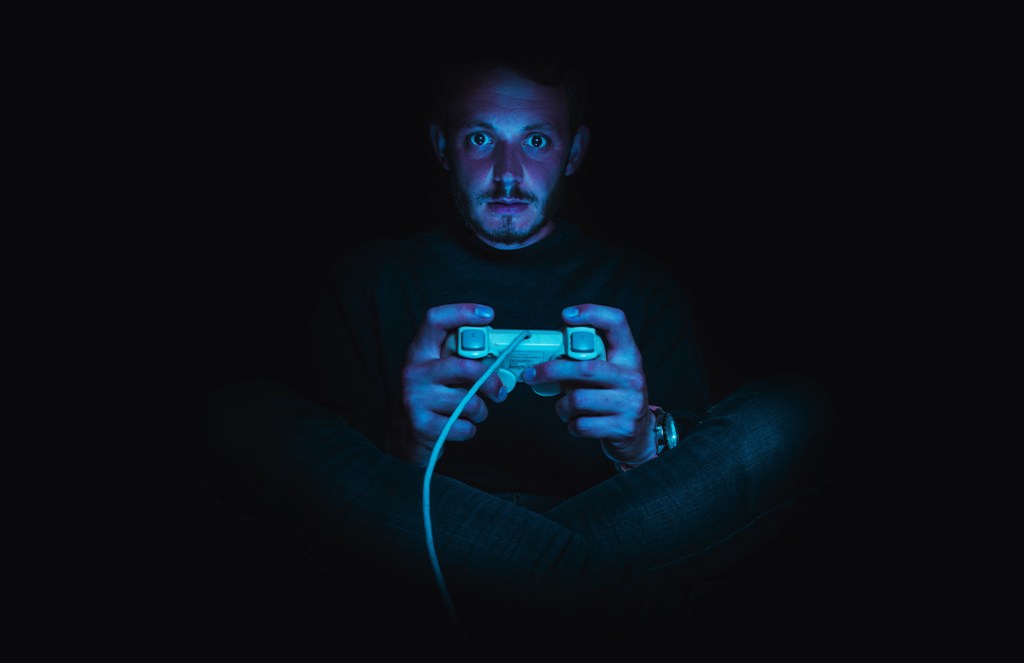 Man gaming in the dark
