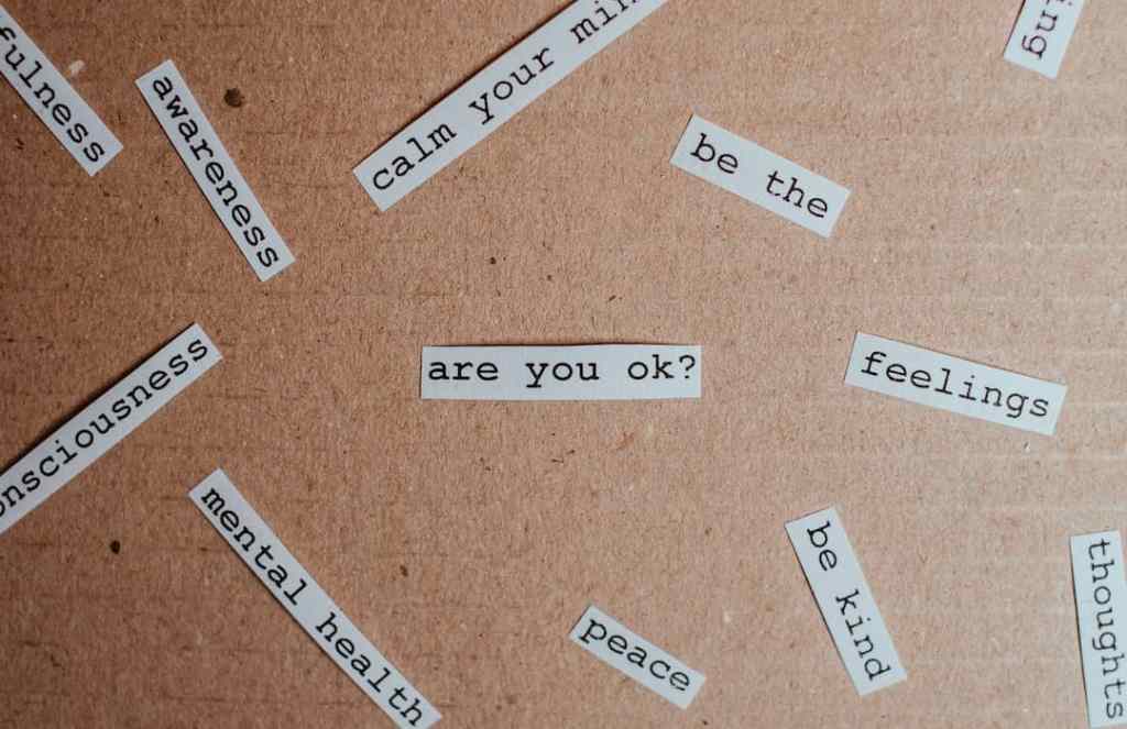 bulletin board with words related to mental health awareness