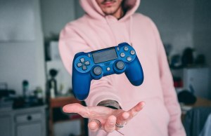 Man with a floating gaming controller