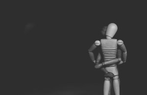 wood human mannequins on black background