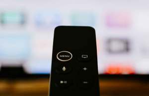 black remote in front of tv screen