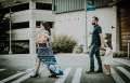 family walking across crosswalk