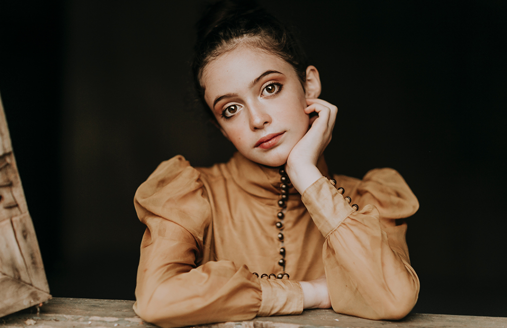 little girl dressed up with makeup