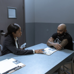 Investigator interviewing suspect interrogation room