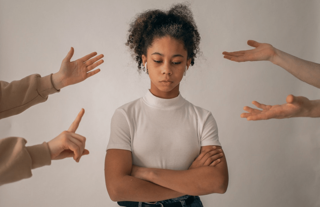 Woman being scolded by many people