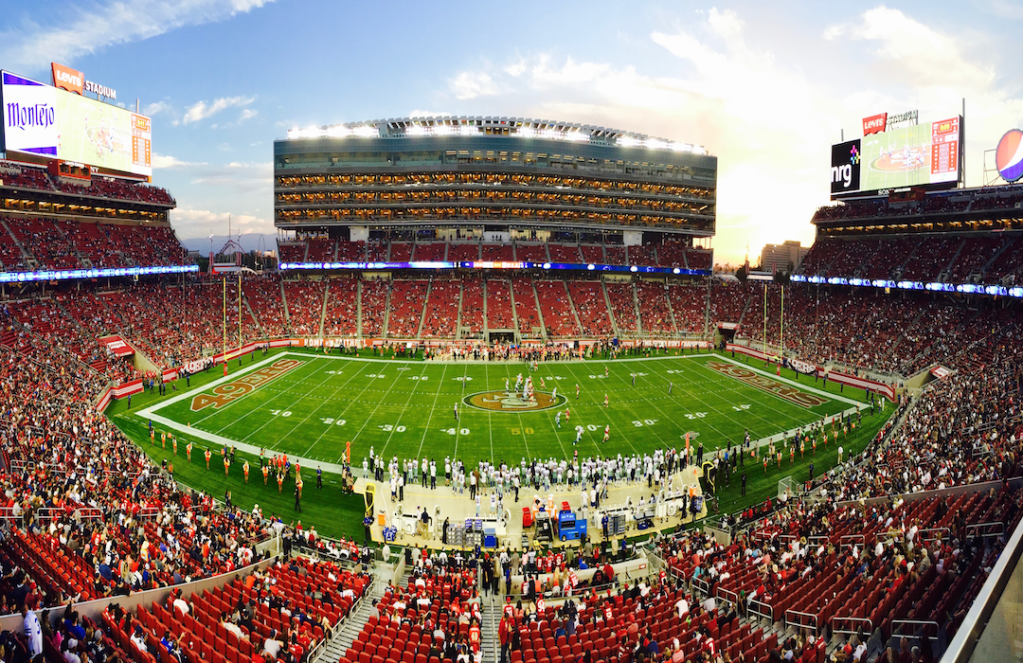 stadium-field-full-with-crowd-watching-the-game-during-daytime