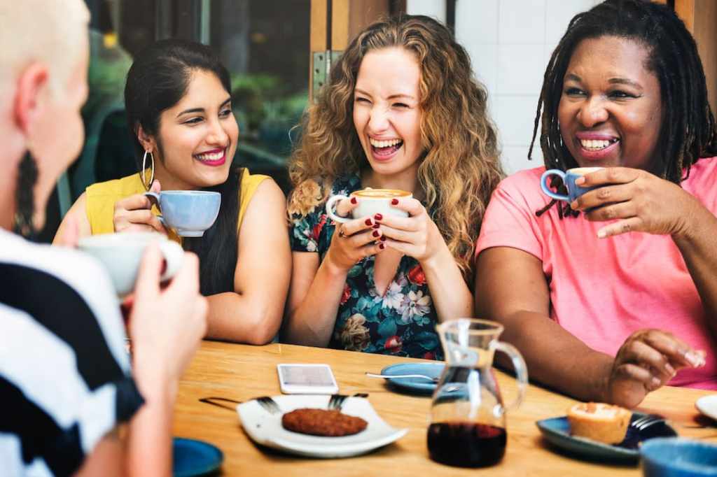 Women drinking coffee together