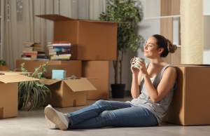 Woman enjoying coffee after moving into her home
