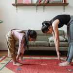 photo-of-woman-and-girl-stretching-their-body