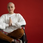 mindful-woman-meditating-with-closed-eyes-in-wheelchair