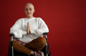mindful-woman-meditating-with-closed-eyes-in-wheelchair