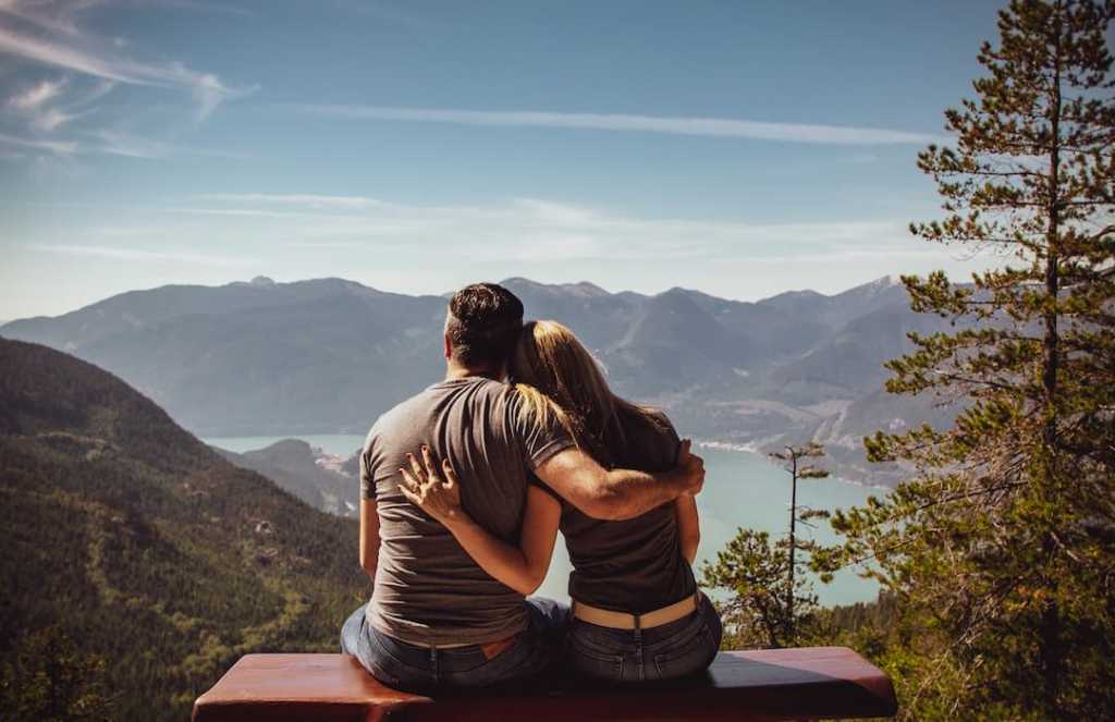 Couple embracing at a viewpoint