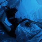 Woman sleeping with a blindfold on