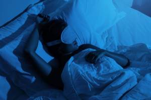 Woman sleeping with a blindfold on