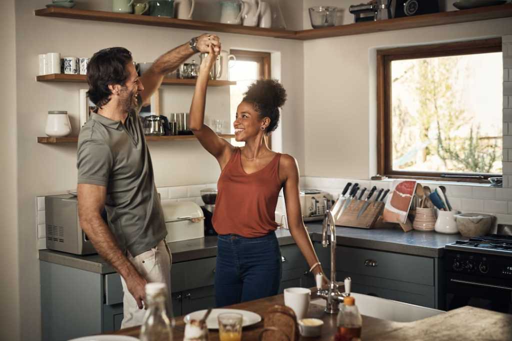 Couple dancing in a kitchen