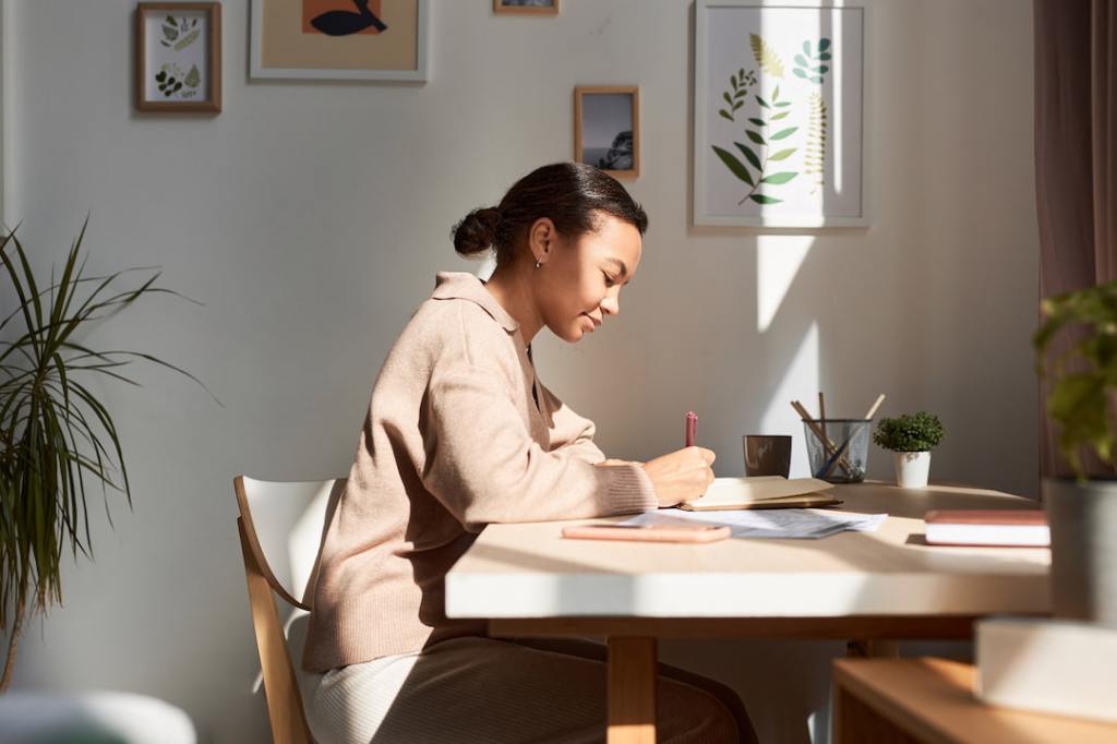Woman writing at a desk