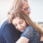 Grown daughter hugging her dad