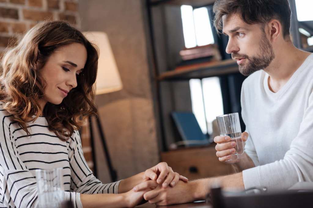 Man and woman holding hands