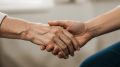 Elderly people holding hands