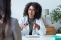 Primary care doctor in consultation with patient in modern medical office