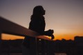 Woman outside watching the sunrise