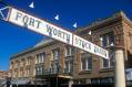 Fort Worth Stock Yards sign hanging above a historic brick building