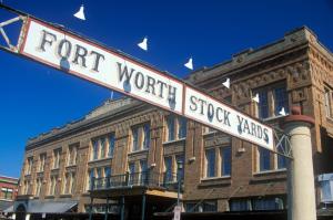 Fort Worth Stock Yards sign hanging above a historic brick building